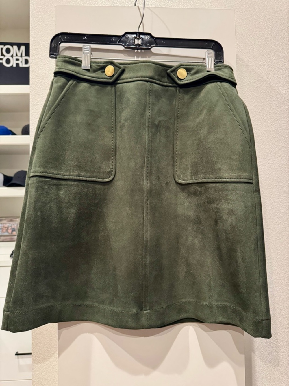 LOFT faux suede design with front patch pockets and gold buttons at the waist.